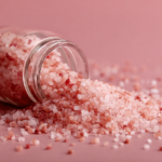 Coarse pink Himalayan salt crystals in a wooden bowl perfect for pink salt recipe seasoning and cooking